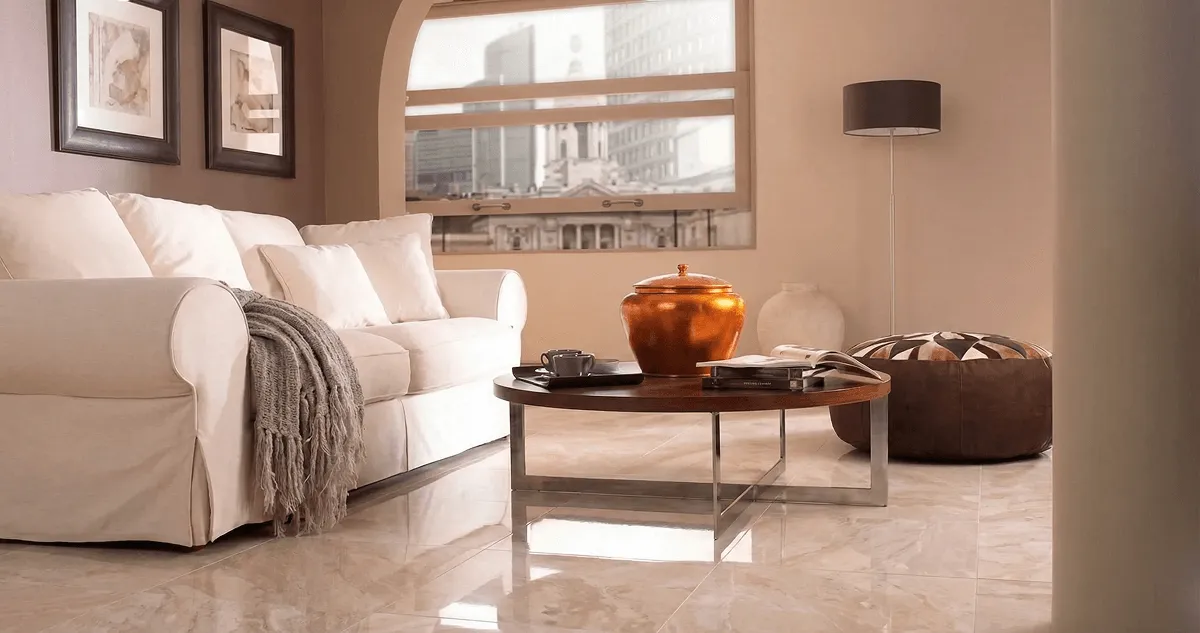 Modern living room with professionally installed marble flooring, a beige sofa, coffee table in Staten Island, NY
