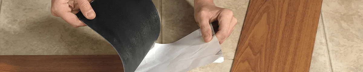 A professional installing vinyl flooring in Staten Island, NY